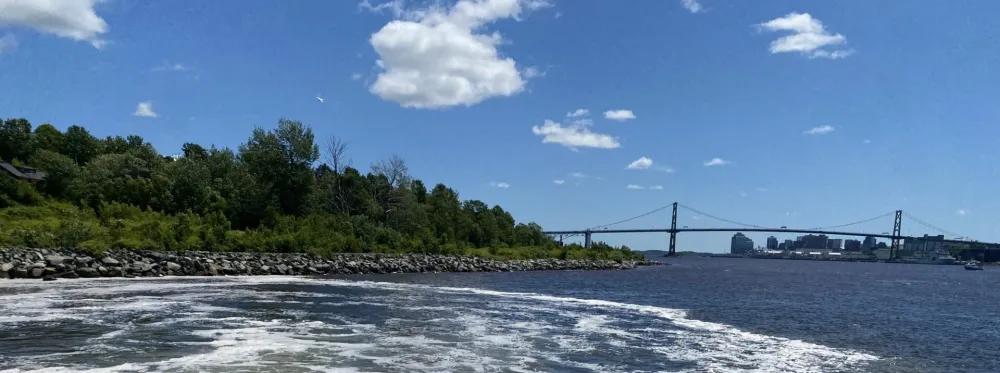 Planetary project in Nova Scotia depicted with ocean view and Halifax bridge.