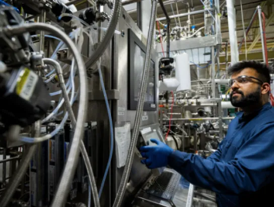 Province Invests in Verschuren Centre Expansion depicted by an employee working in the biomanufacturing facility.