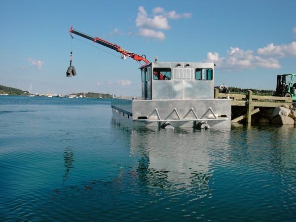 ABCO's 36’ Service Barge tied up at wharf