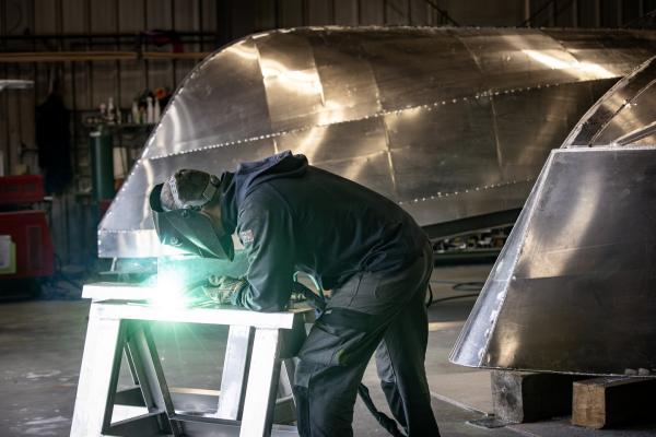 ABCO employee welding in shop