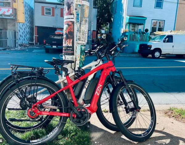 ebikes propped up against a pole on street in Halifax