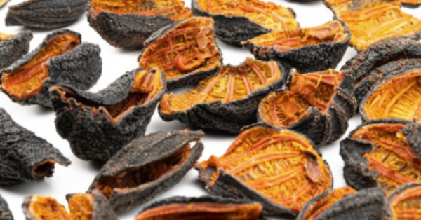 Orange interior, black exterior sea cumber cut in football style