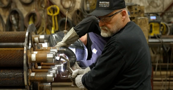 Man working in pressure fabrication facility