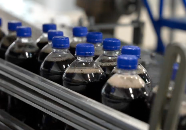 Bottles of Pepsi on an assembly line