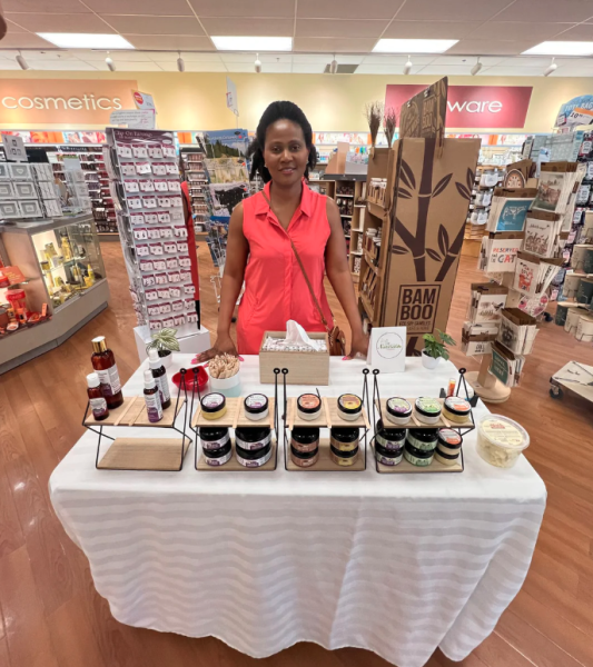 Simply Go Natural founder with product display