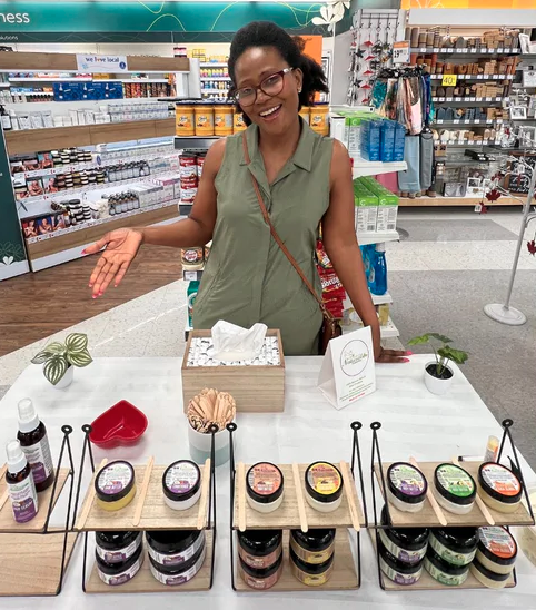 Simply Go Natural founder with product display