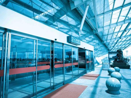 Outside entrance at airport with glass sliding doors