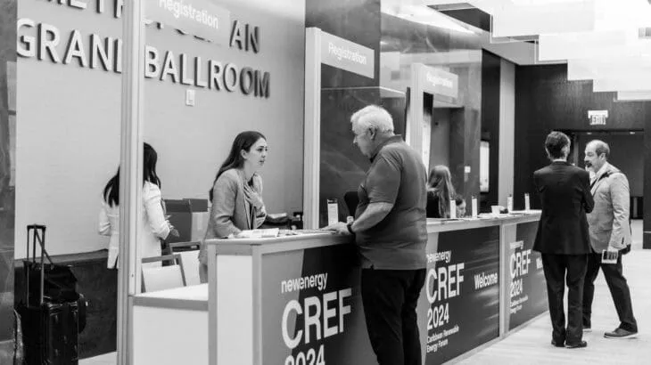CREF volunteers assisting attendees.